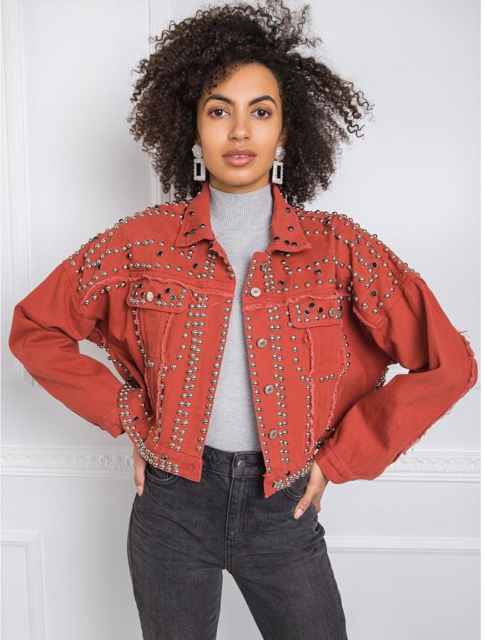 Brick-red studded denim jacket